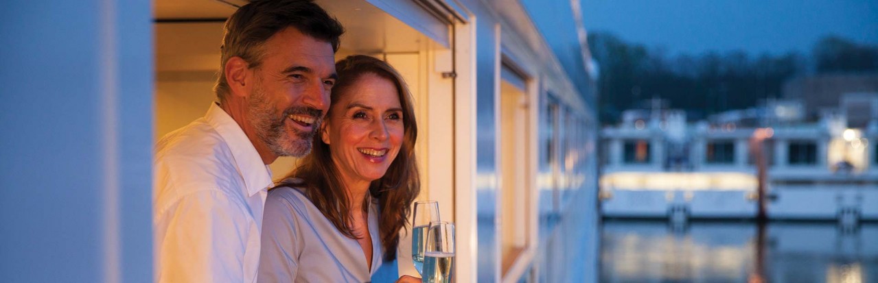 Couple on Emerald Waterways Grand Balcony Suite 